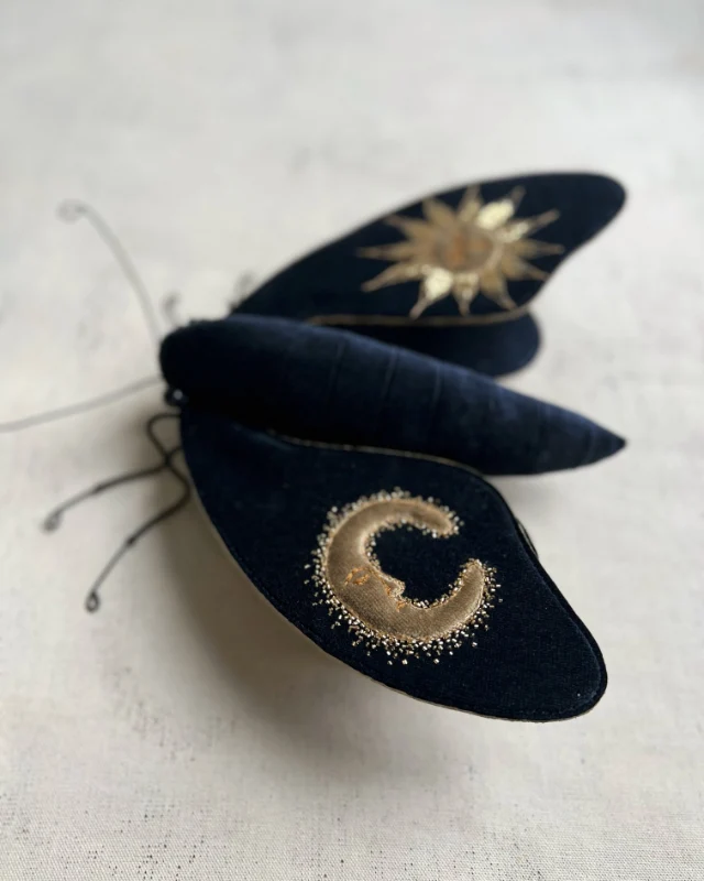 Vintage embroidered moths by Larysa Bernhardt on dark blue velvet